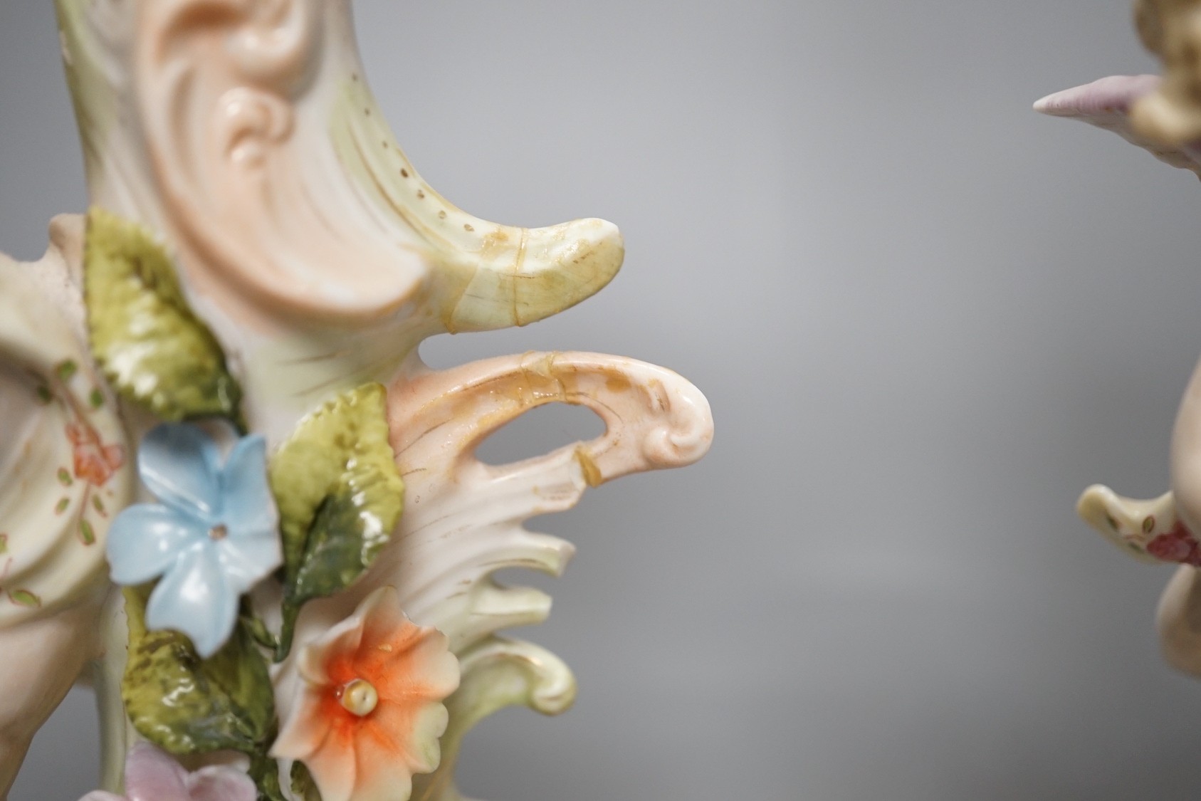 A Meissen flower painted pierced dish and two German porcelain candlesticks - 25.5cm tall